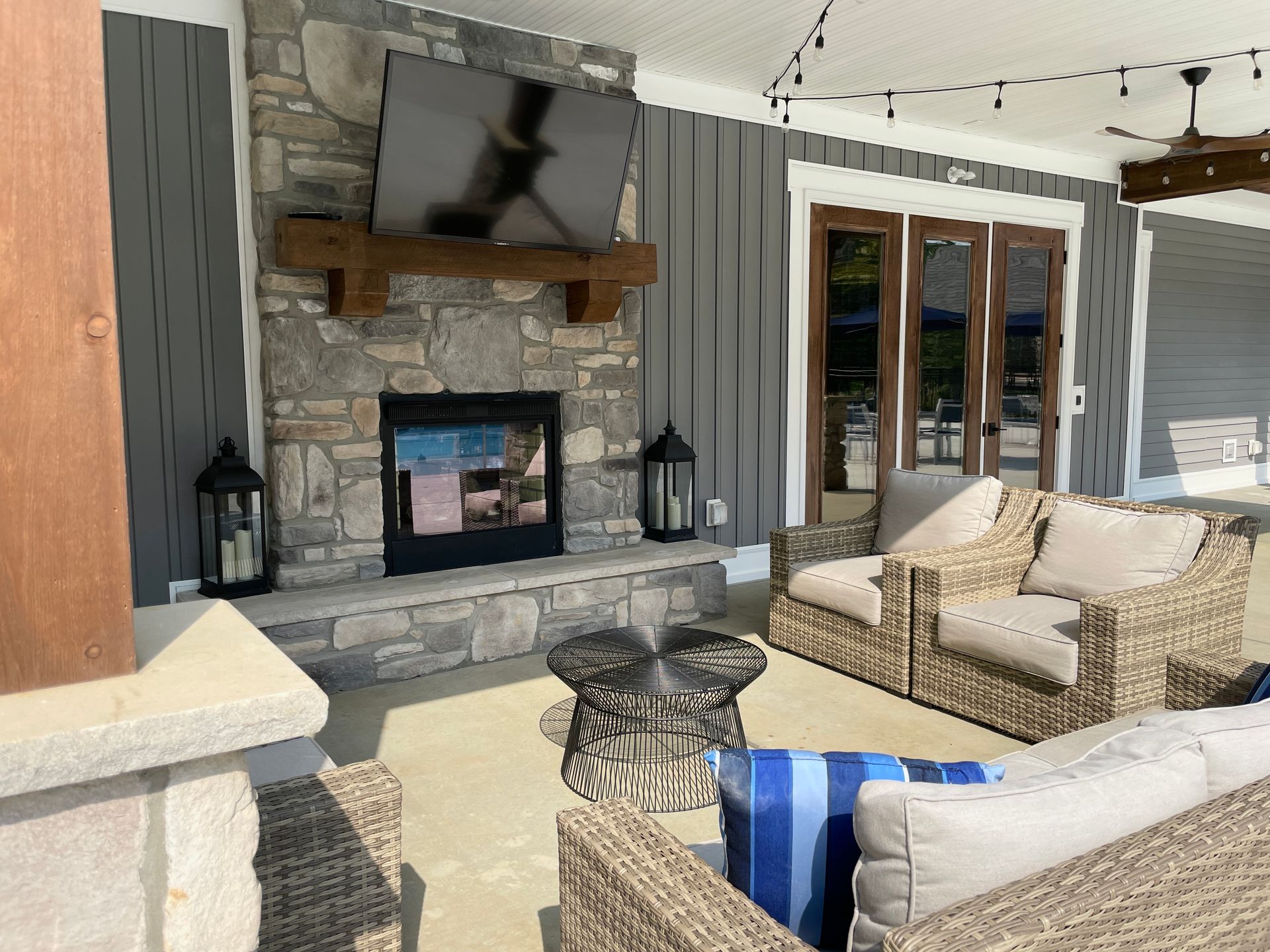 A living room with a fireplace and a flat screen tv