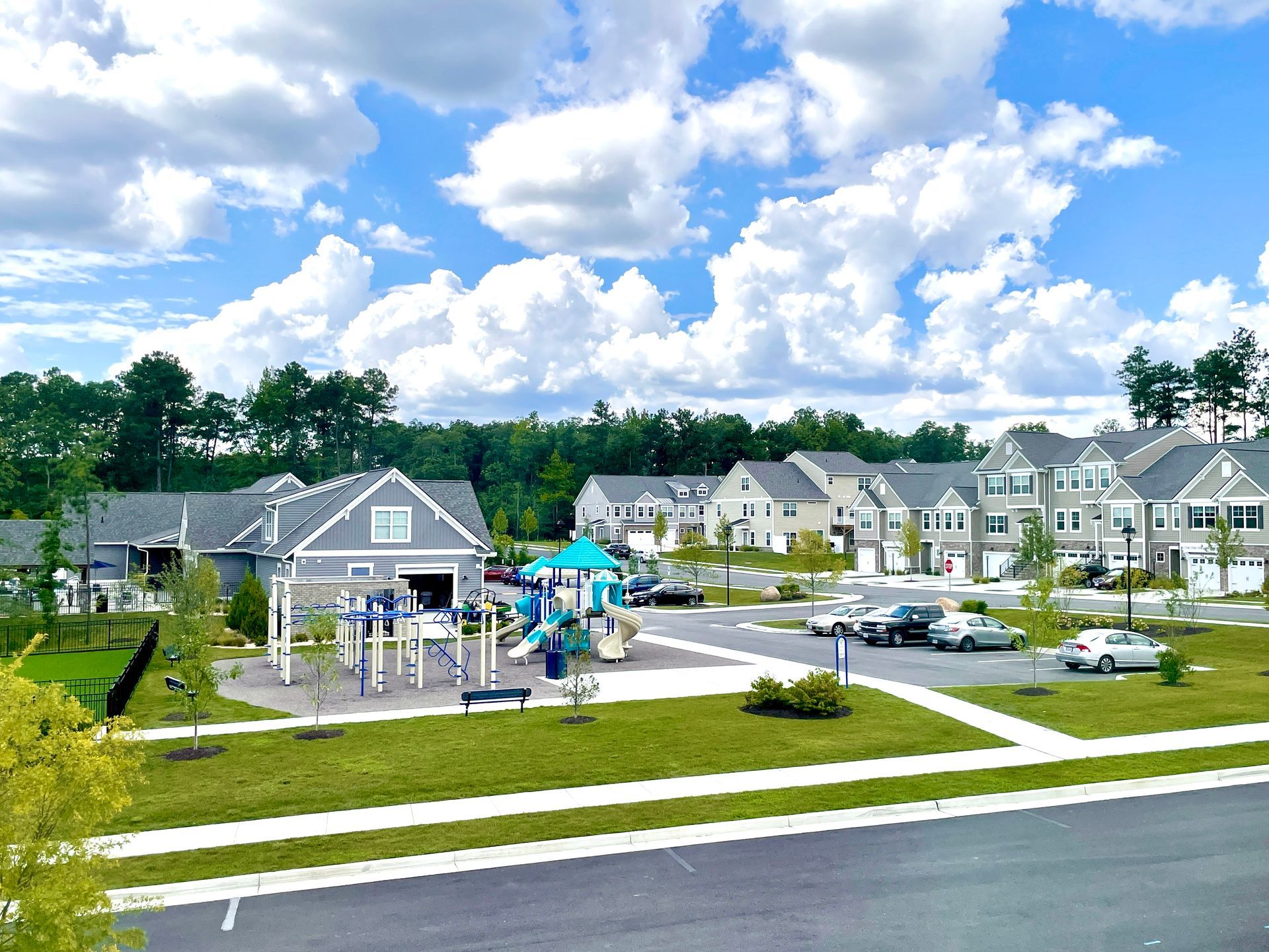 There is a playground in the middle of a residential area.
