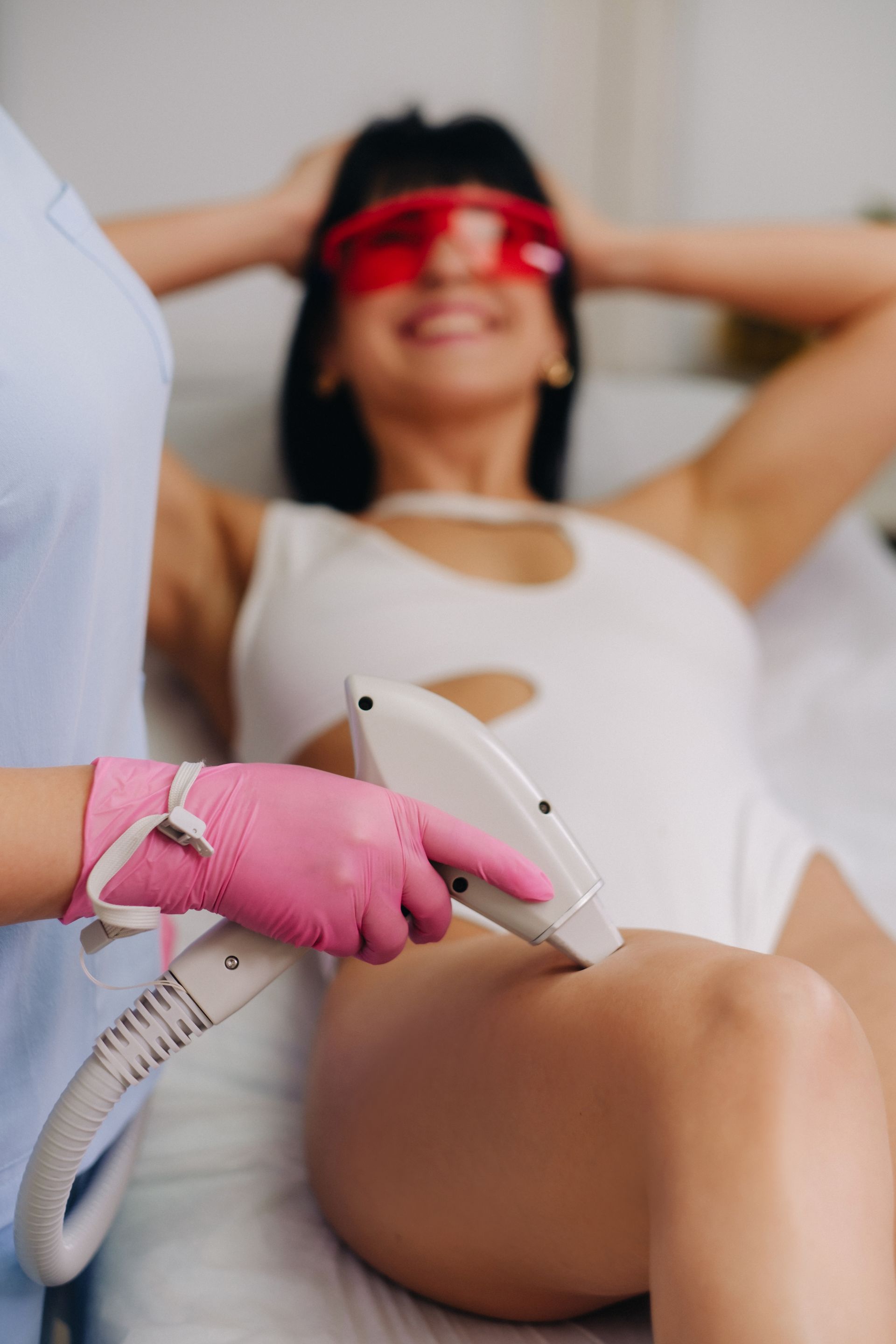 woman getting laser hair removal on legs