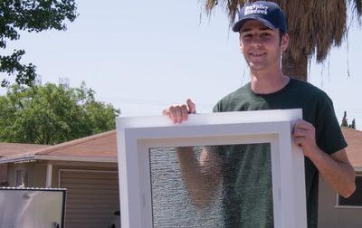 Window Replacement — Man Installing Window in Fresno, CA