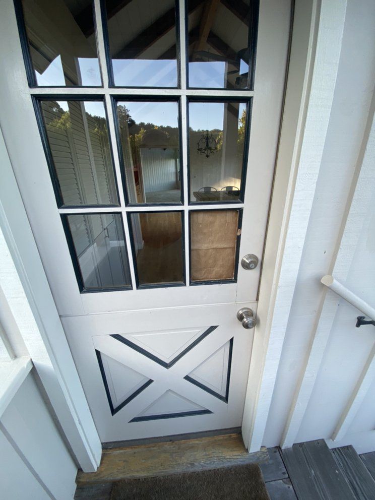 A white door with a black x on it