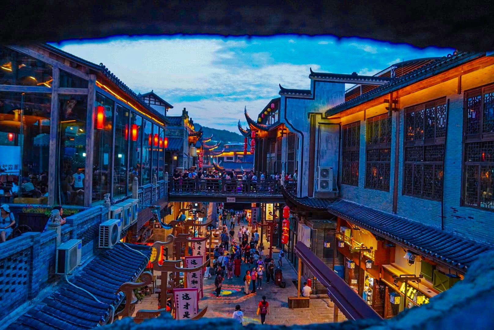An aerial view of a busy city street at night.