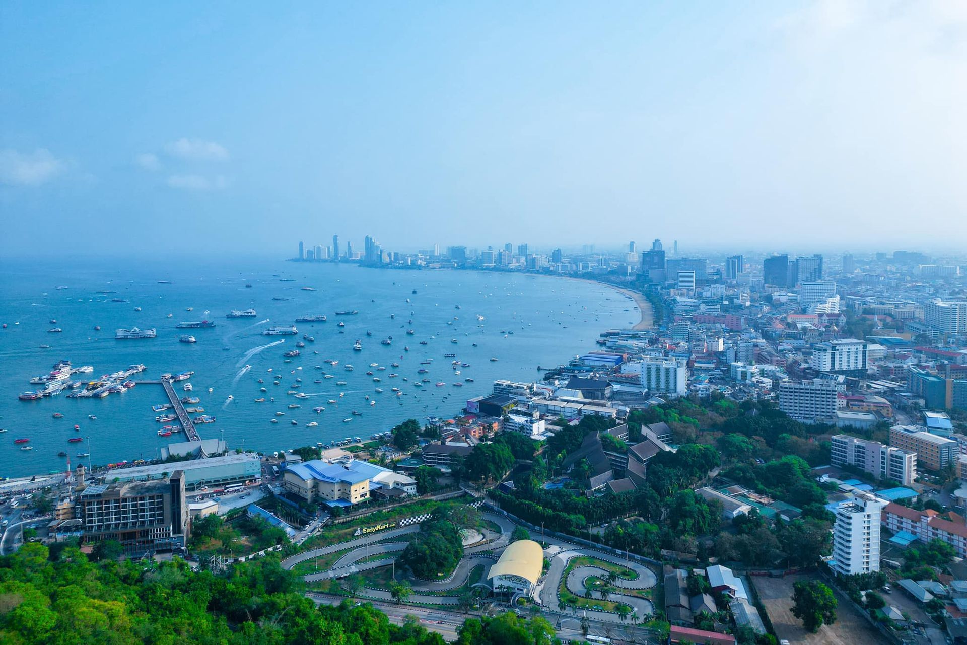 An aerial view of a city surrounded by water and boats.