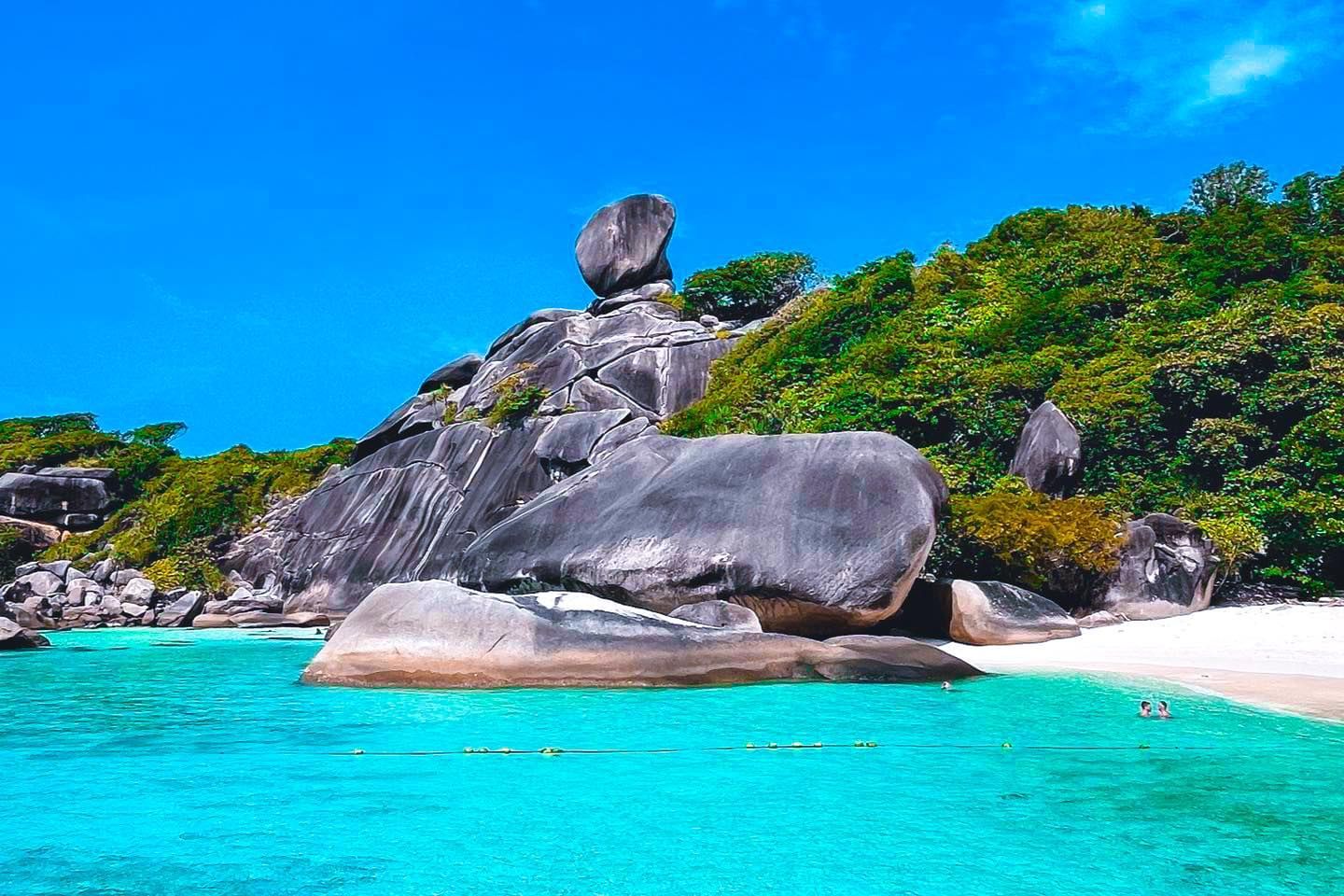 There is a large rock in the middle of the ocean on similan islands..