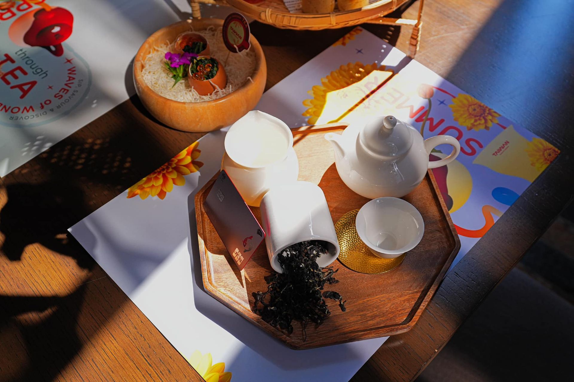 A table with a sign that says tea on it