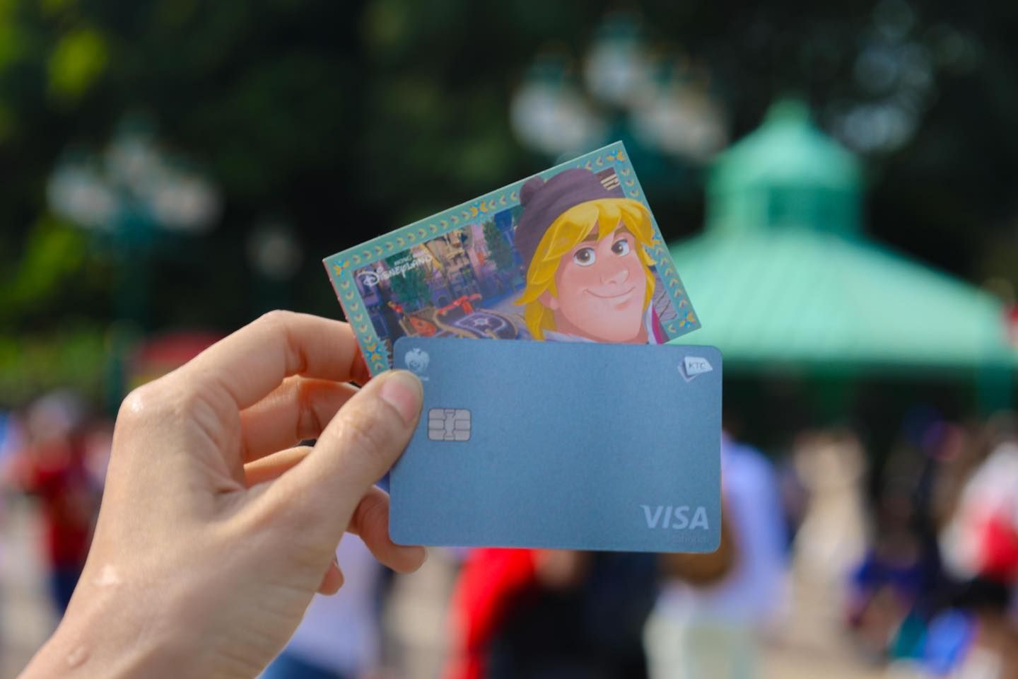 A person is holding two KTC credit cards in their hand.