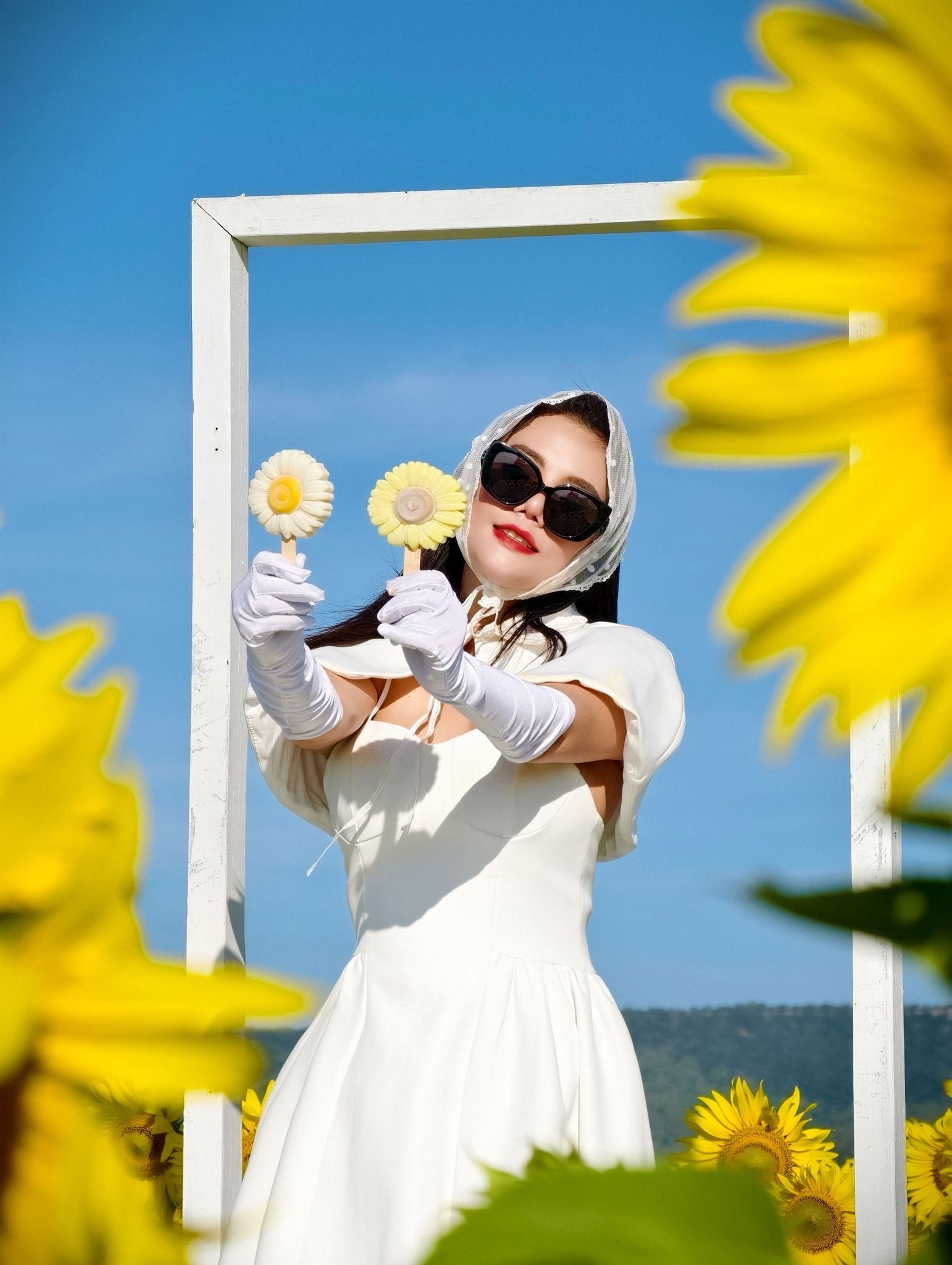 A woman in a white dress is holding 3D ice-cream