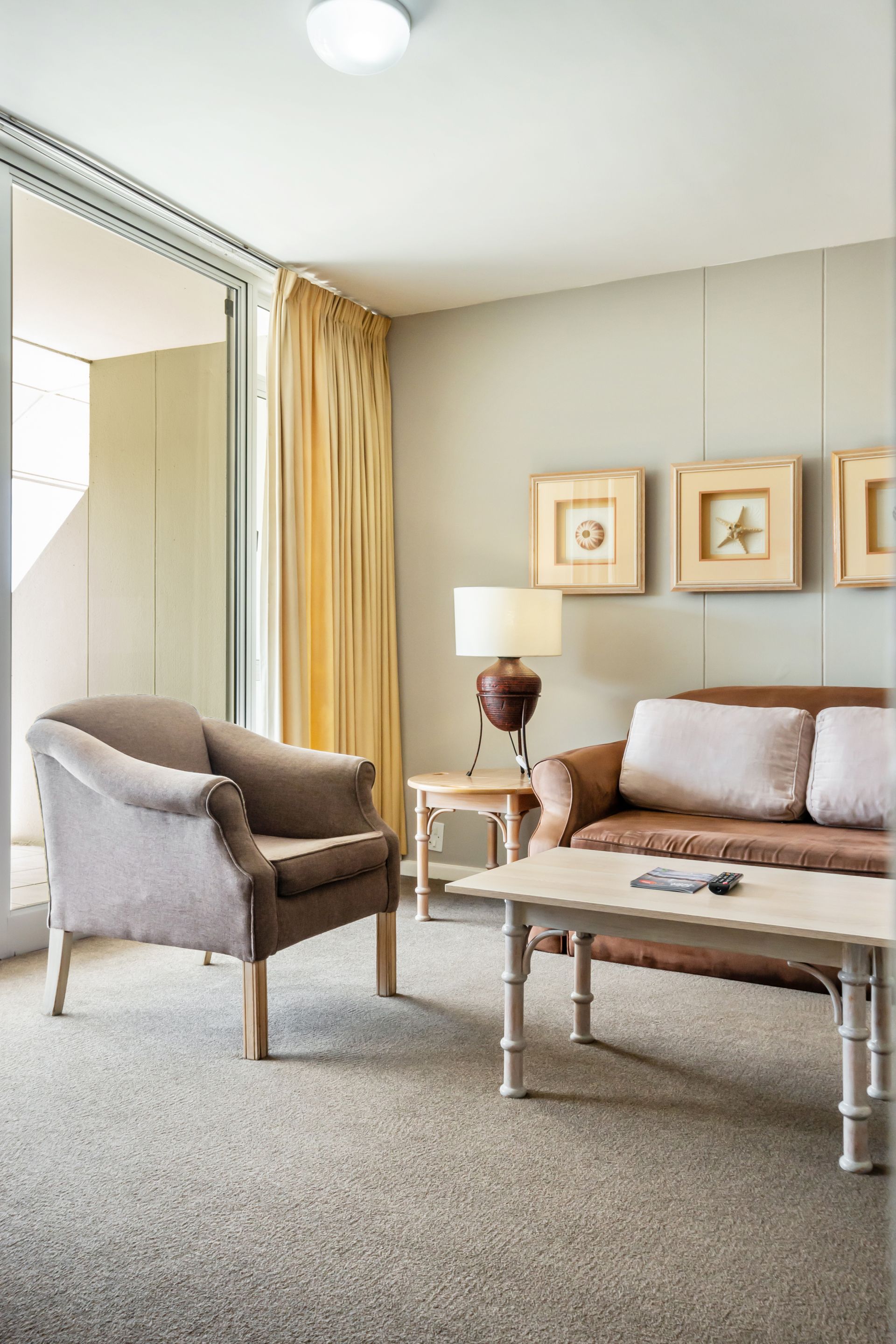 A living room with a couch a chair and a coffee table