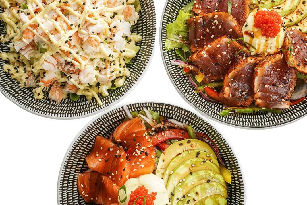 Three bowls of different types of food on a white background.