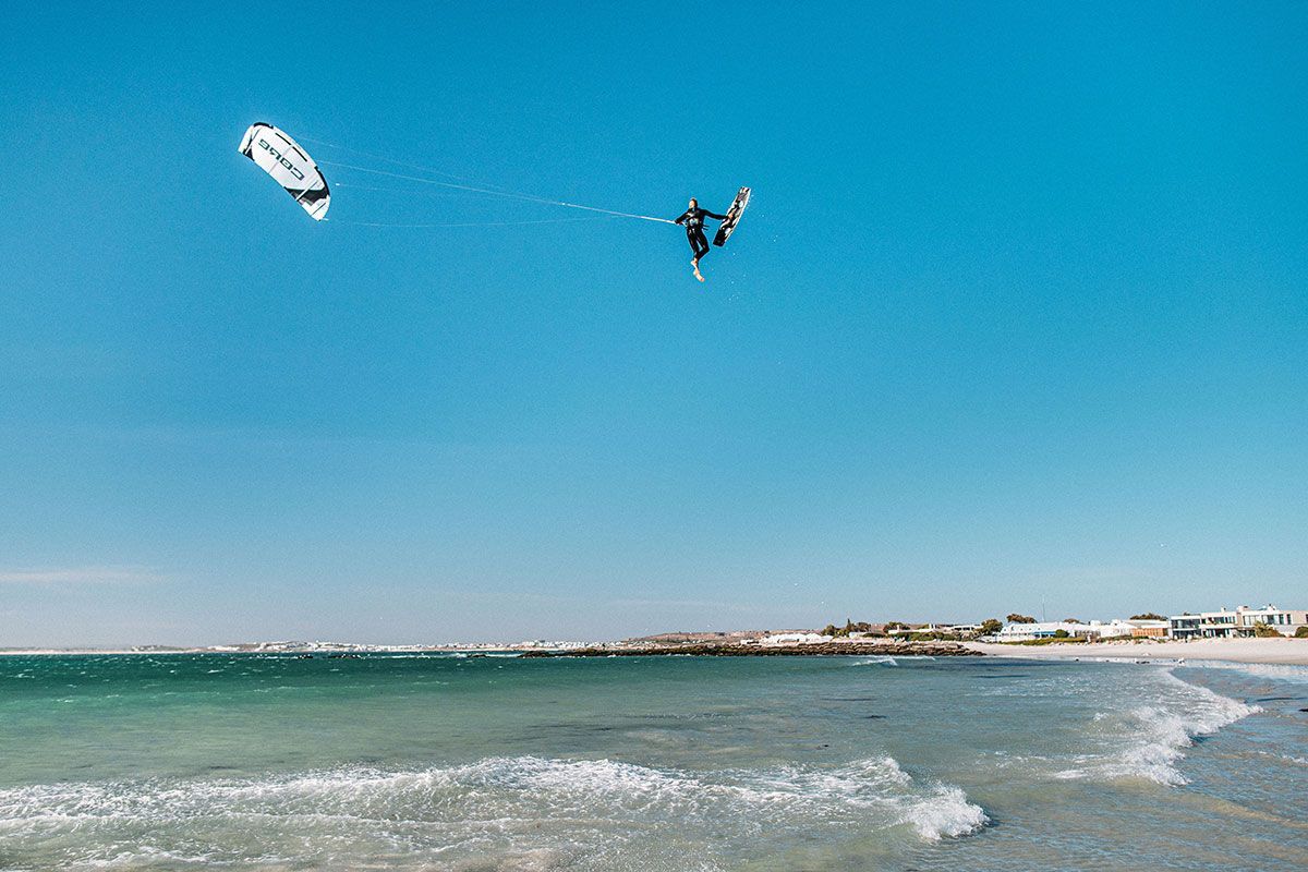 A person is flying a kite over a beach.