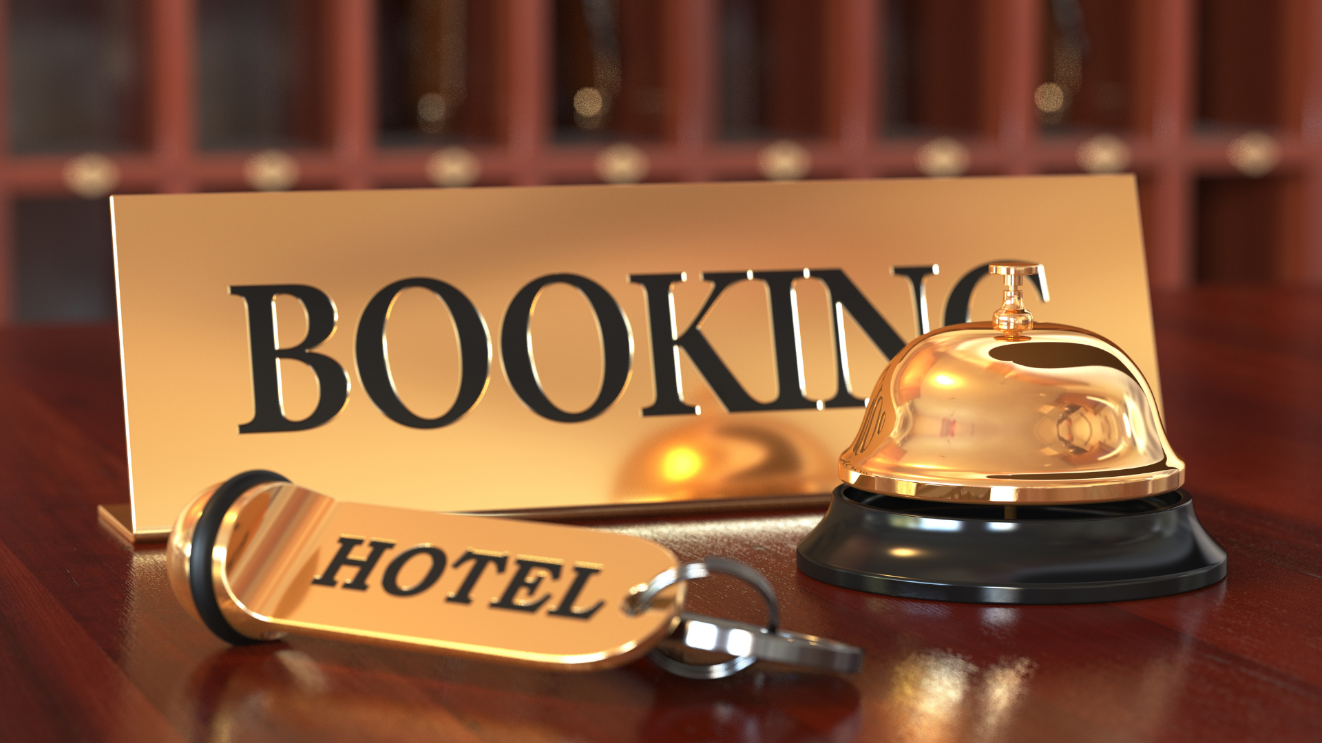 A hotel bell is on a table next to a sign that says booking hotel