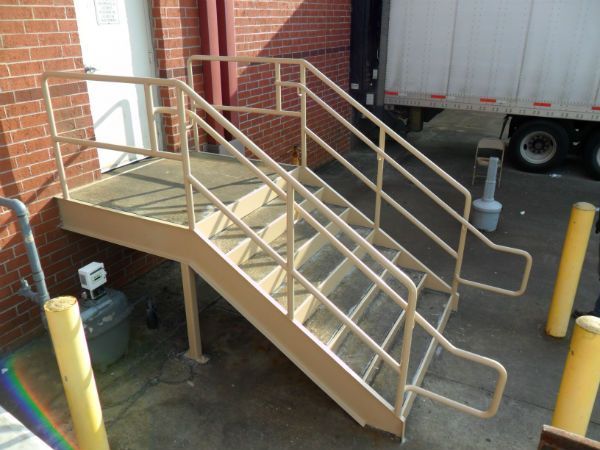 A set of stairs leading up to a brick building