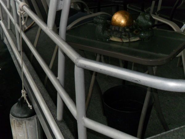 A boat with a table and chairs on it