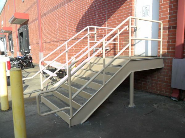 A set of stairs leading up to a brick building