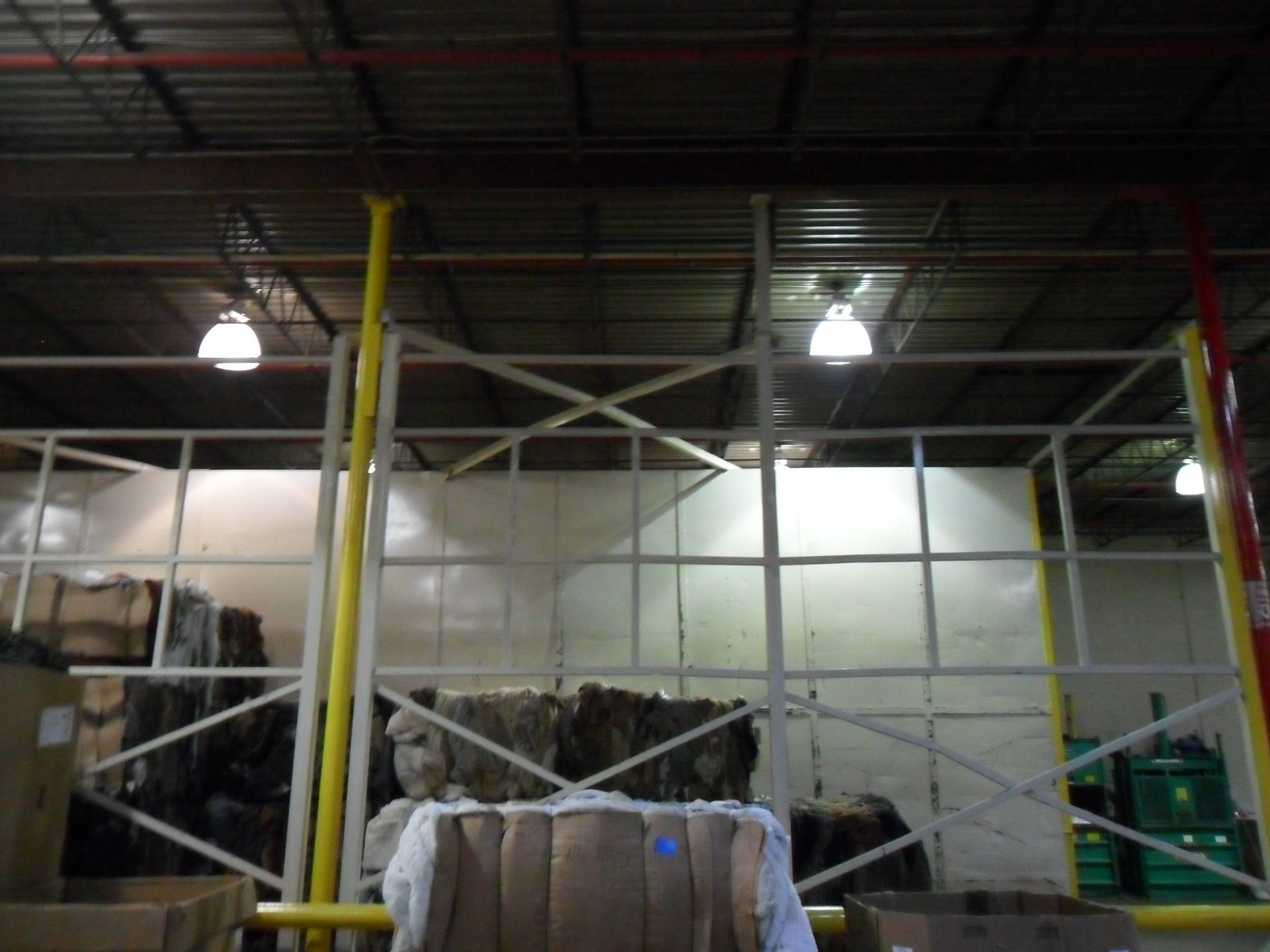 A warehouse with a bunch of boxes stacked on top of each other