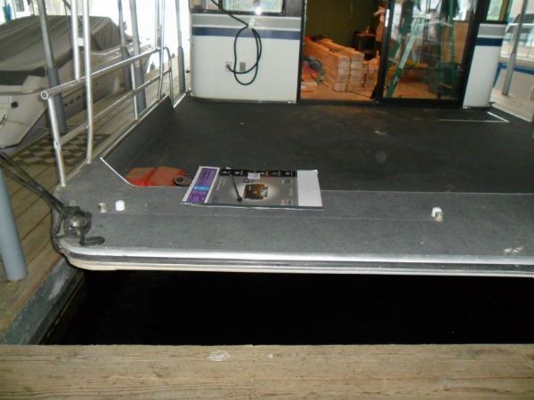 A boat with a magazine laying on the deck