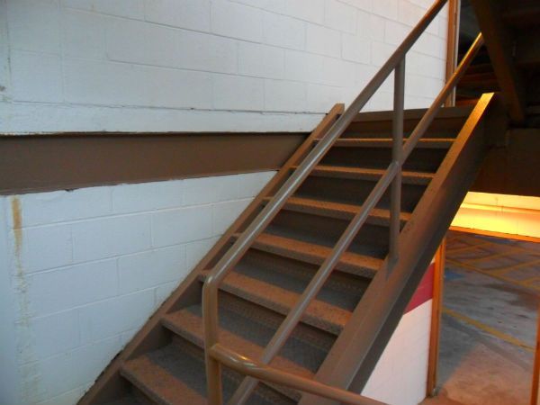 A set of stairs going up to the second floor of a building