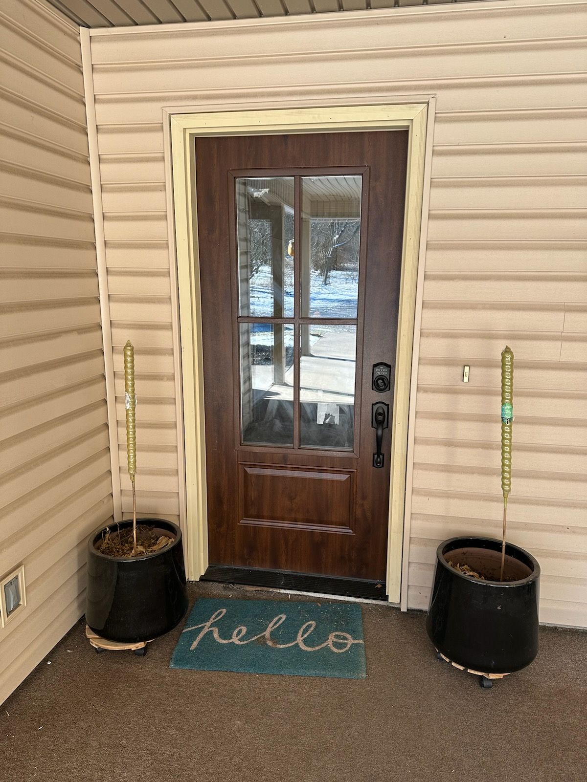 A door with a hello mat in front of it