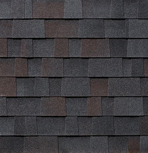 A close up of a row of shingles on a roof.