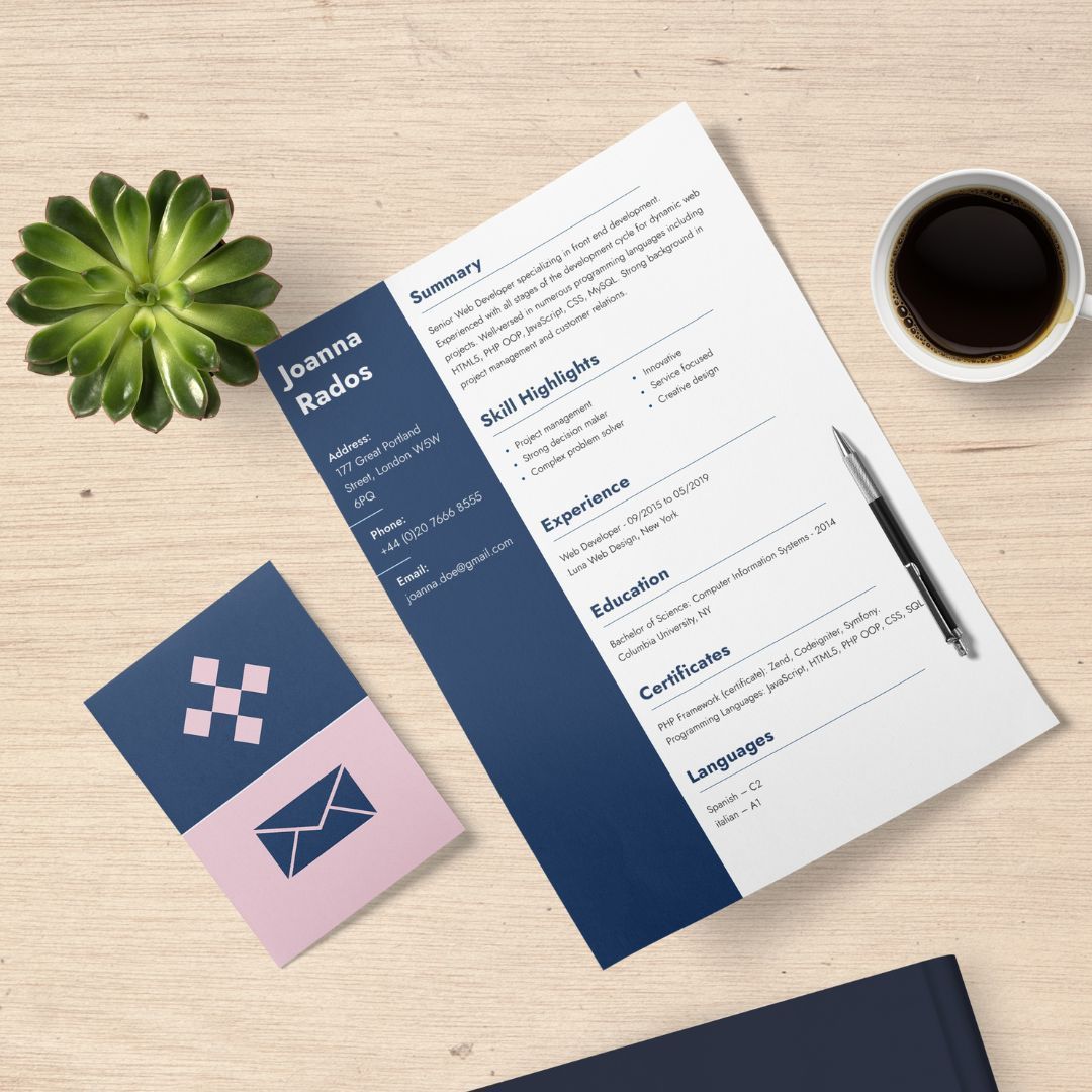 A resume is sitting on a wooden table next to a cup of coffee