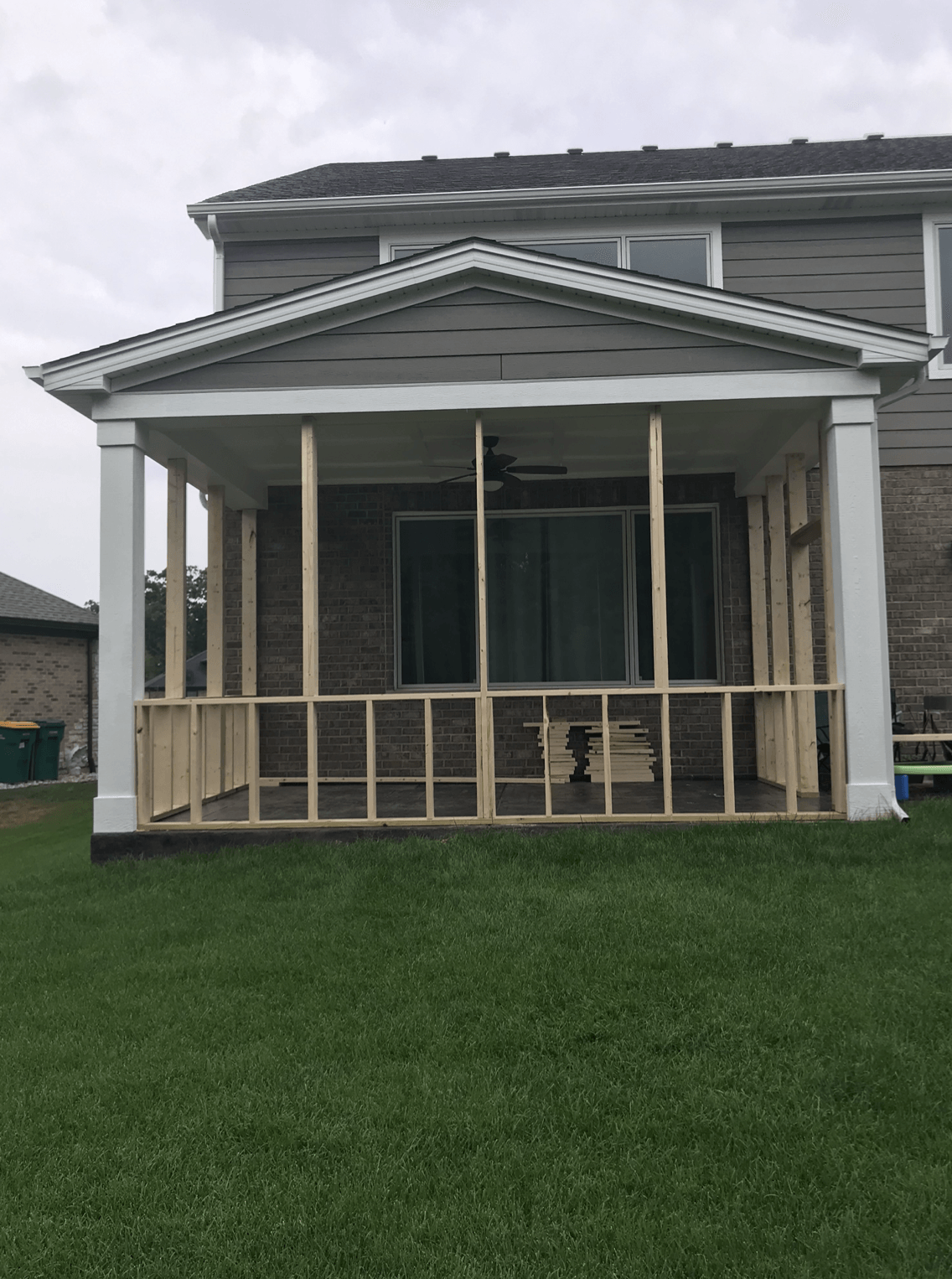 A porch is being built on the side of a house