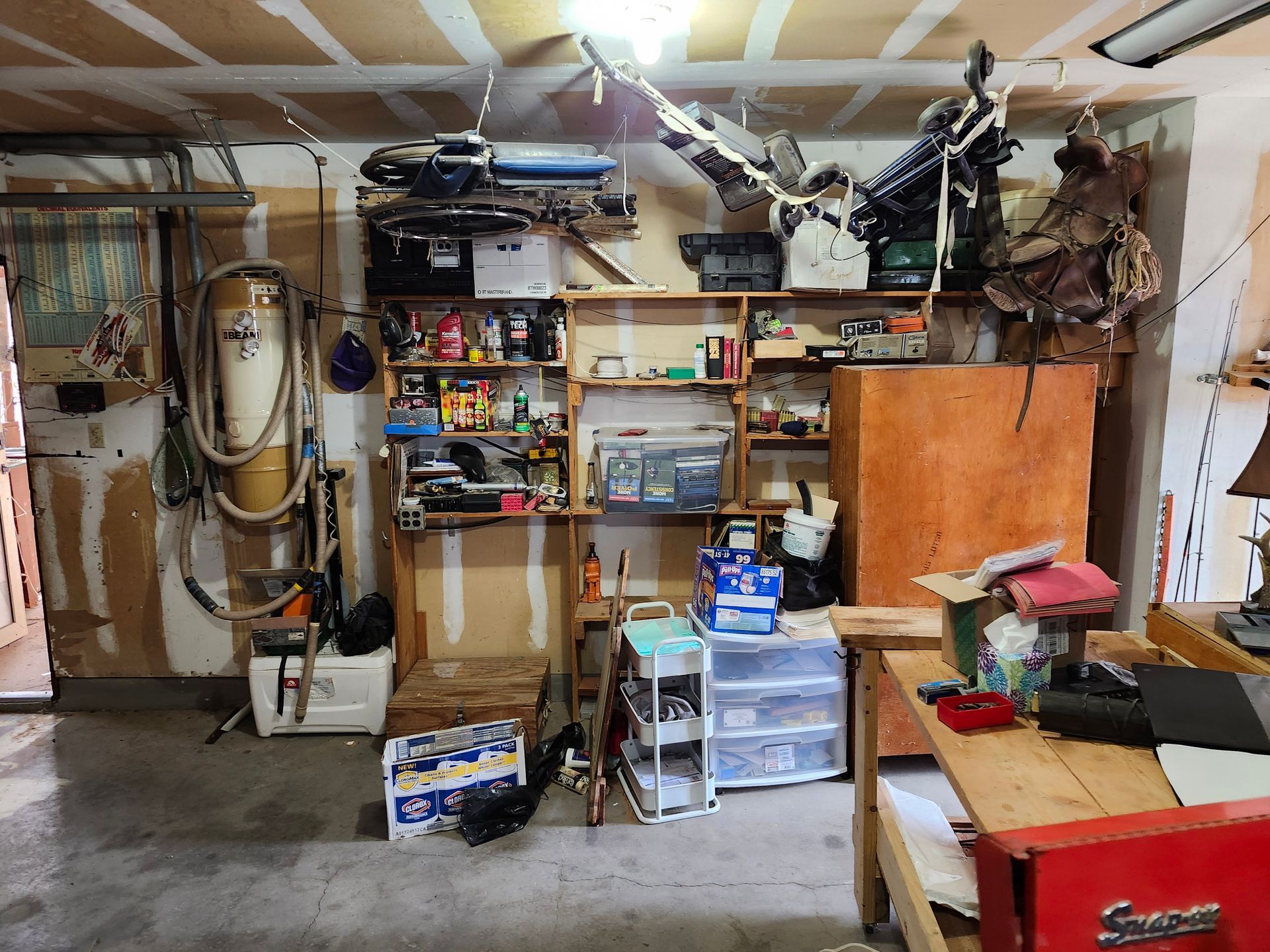 A garage filled with lots of tools and boxes