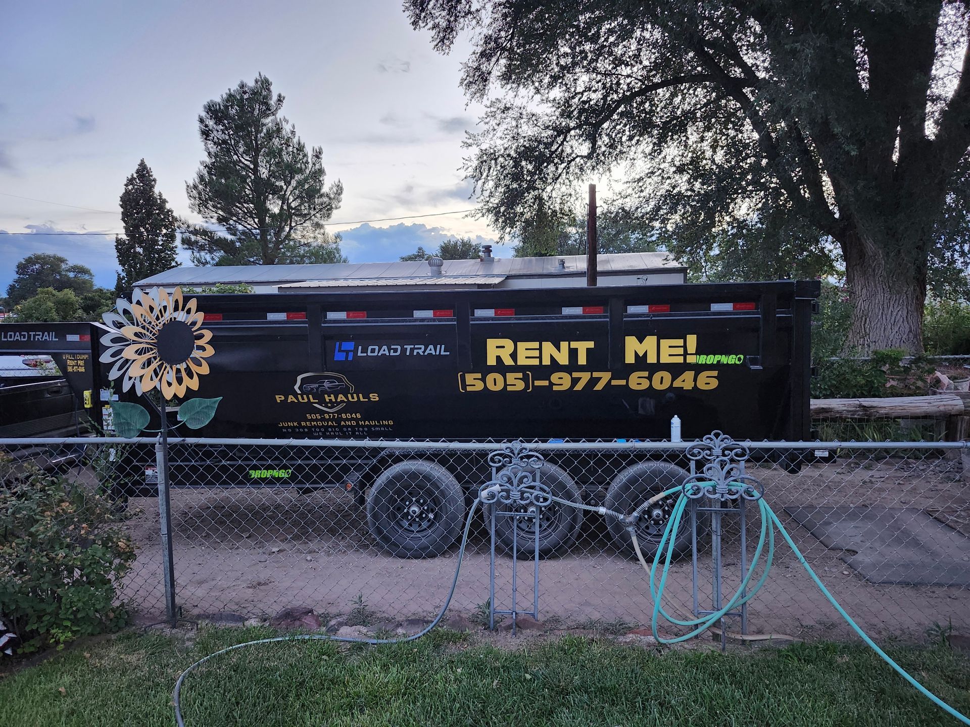 A dump truck that says rent me on the side
