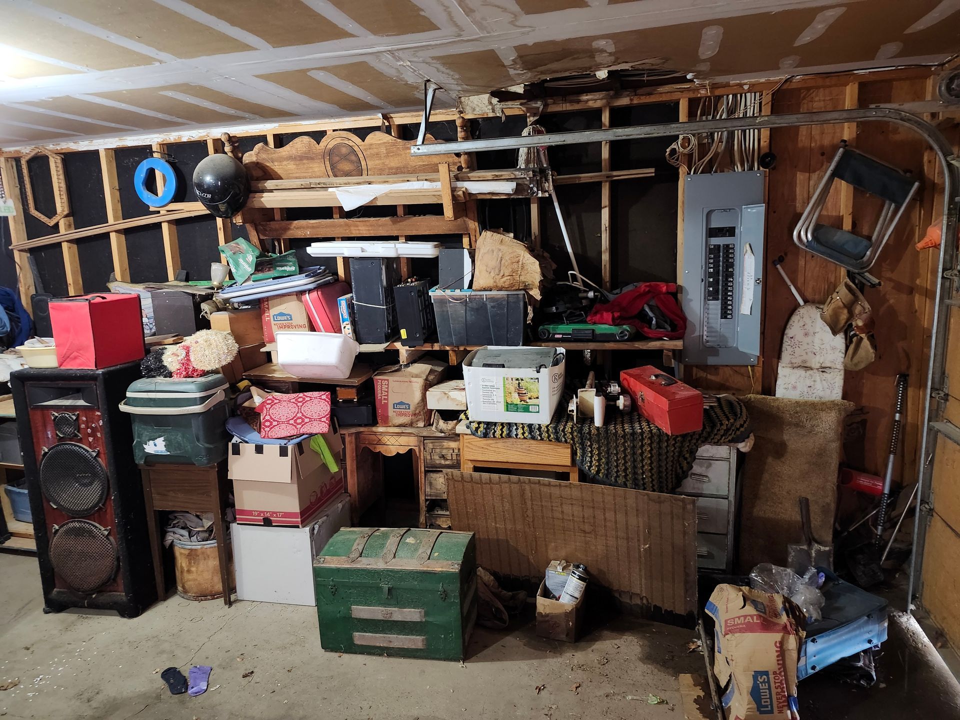 A garage filled with lots of boxes and a speaker