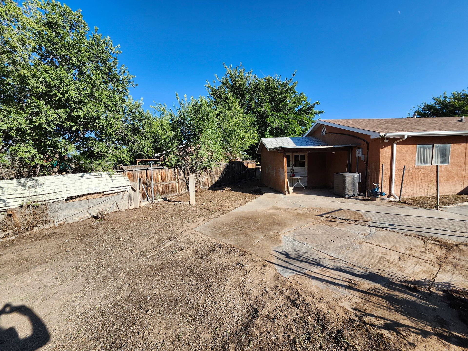 A house with a lot of dirt in front of it.