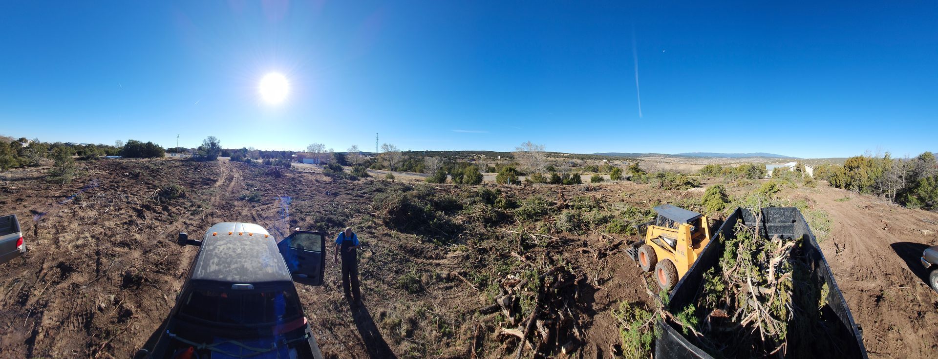 A person is riding a motorcycle on a dirt road.