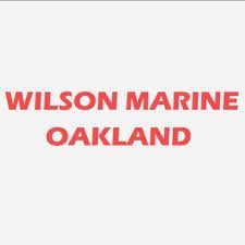 The wilson marine oakland logo is red on a white background.