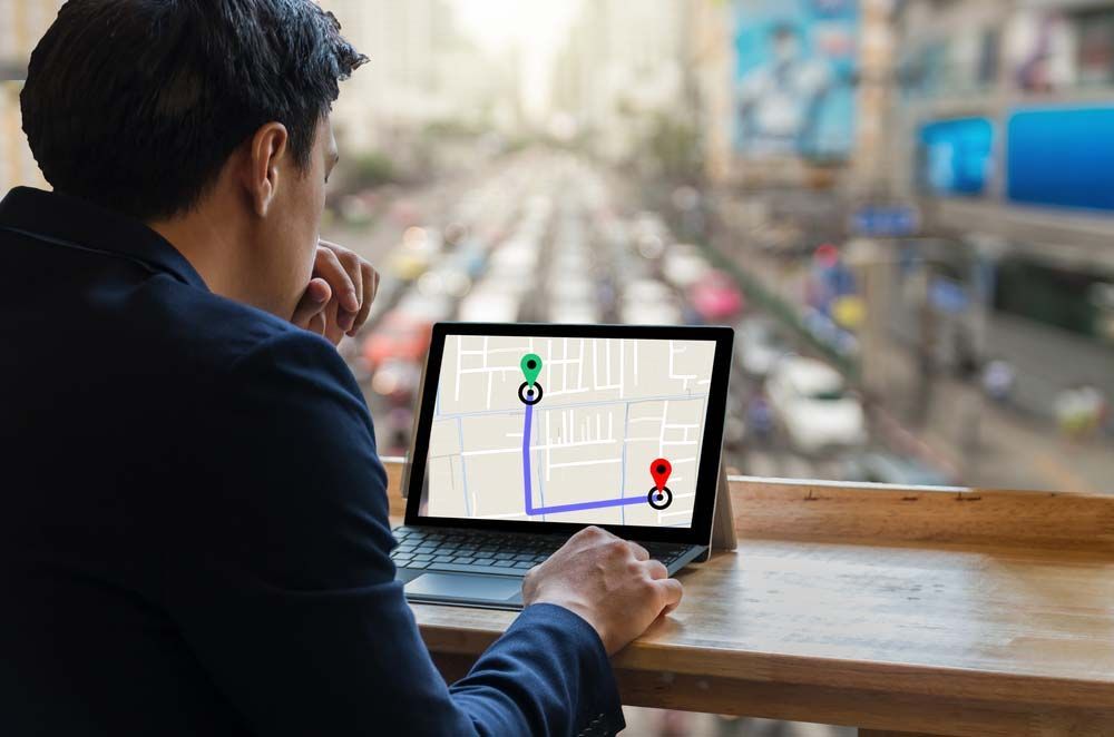 Businessman Using A Laptop Showing A Navigator Map - Fuel Tax Credit In Toowoomba, QLD