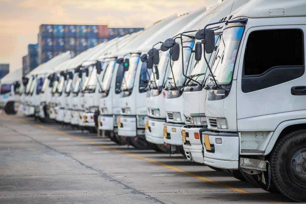 Fleet Of White Truck Parked At A Port