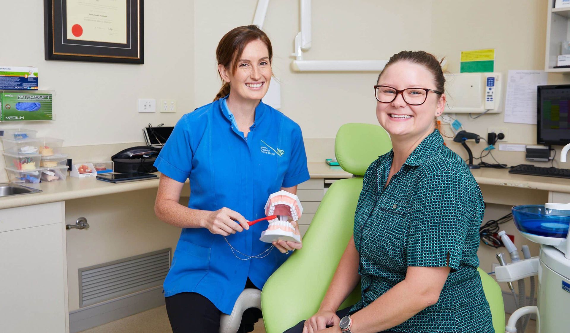 Dentist In Cairns Educating Her Patient Inside The Dental Clinic