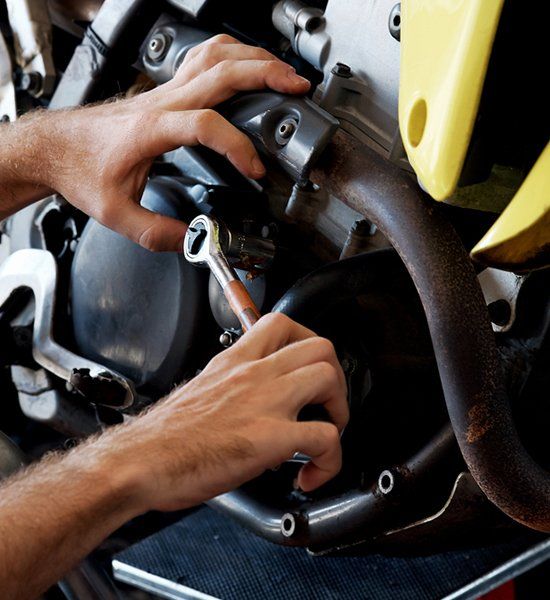 Mechanic Repairing Motorcycle  — Motorbike Repairs in Lismore, NSW