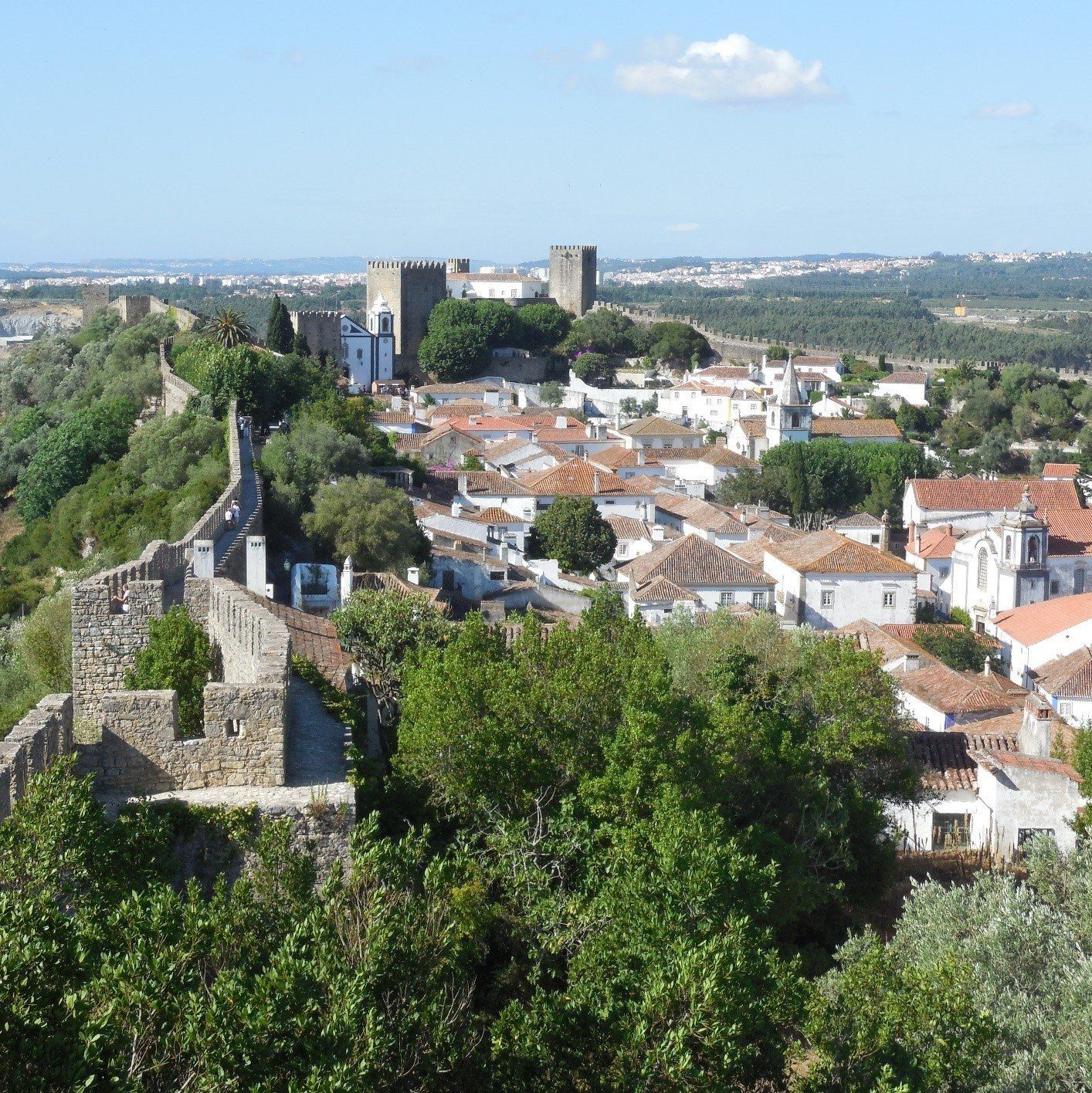 In Obidos on walkway on the walls looking from the entrance to the Castle. The Castle is a hotel known as a pousada.