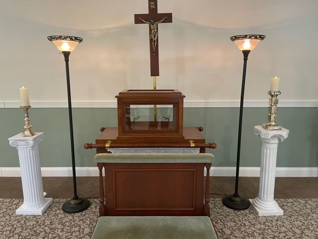 A church altar with a cross and candles