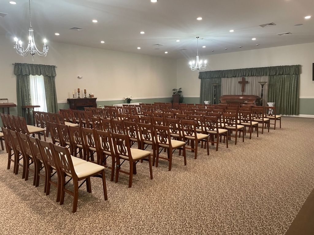 A large room filled with rows of chairs in a church.