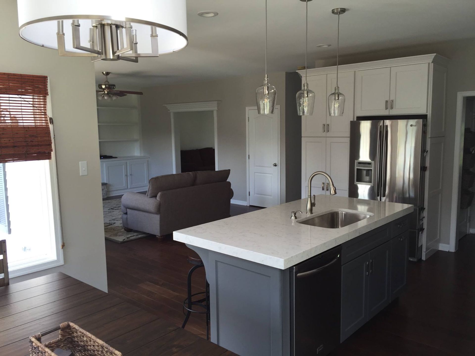 A kitchen with a large island and a sink