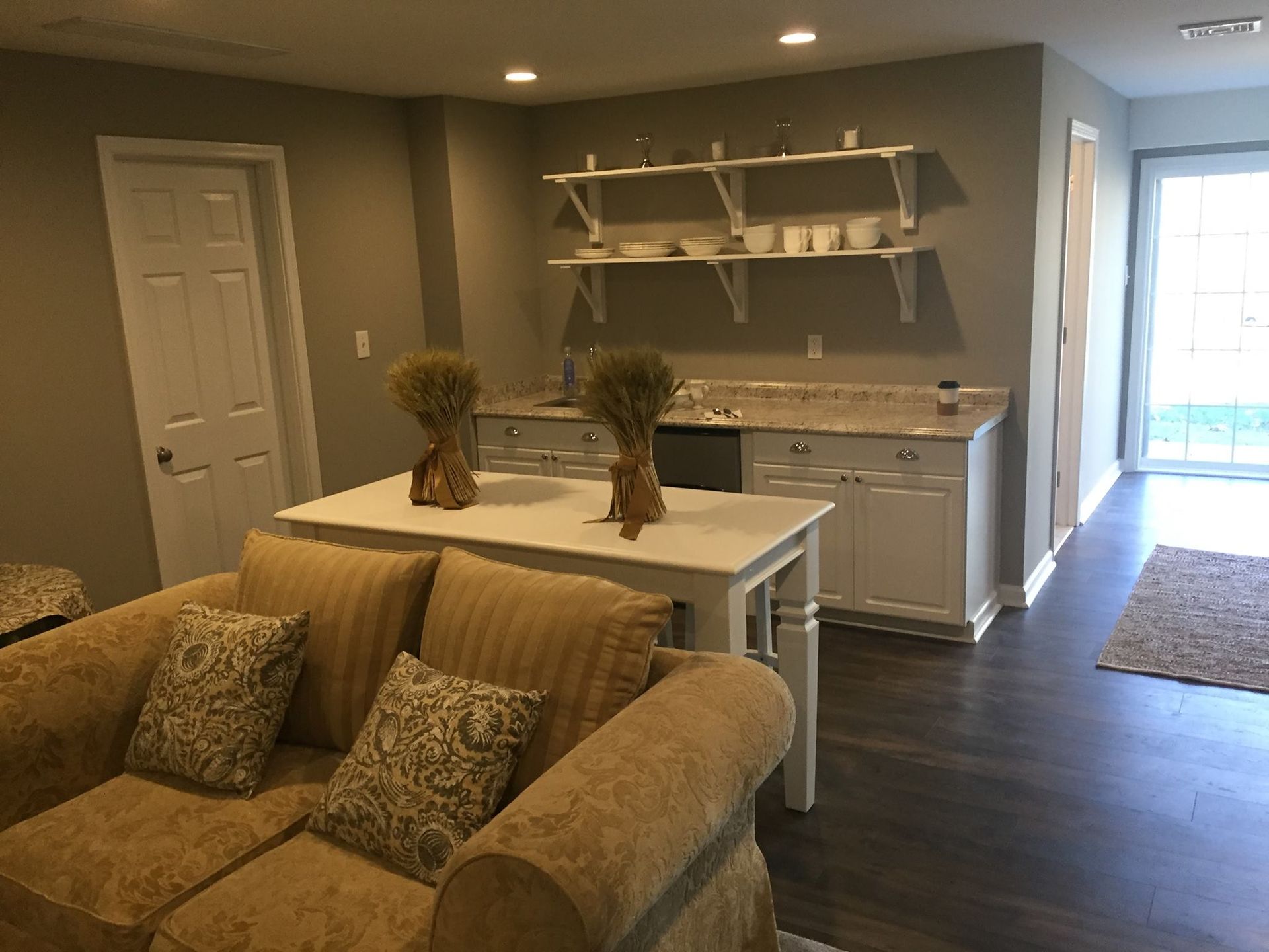 A living room with a couch and a table in it