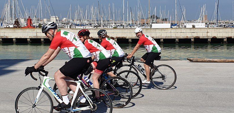 Four people riding bikes