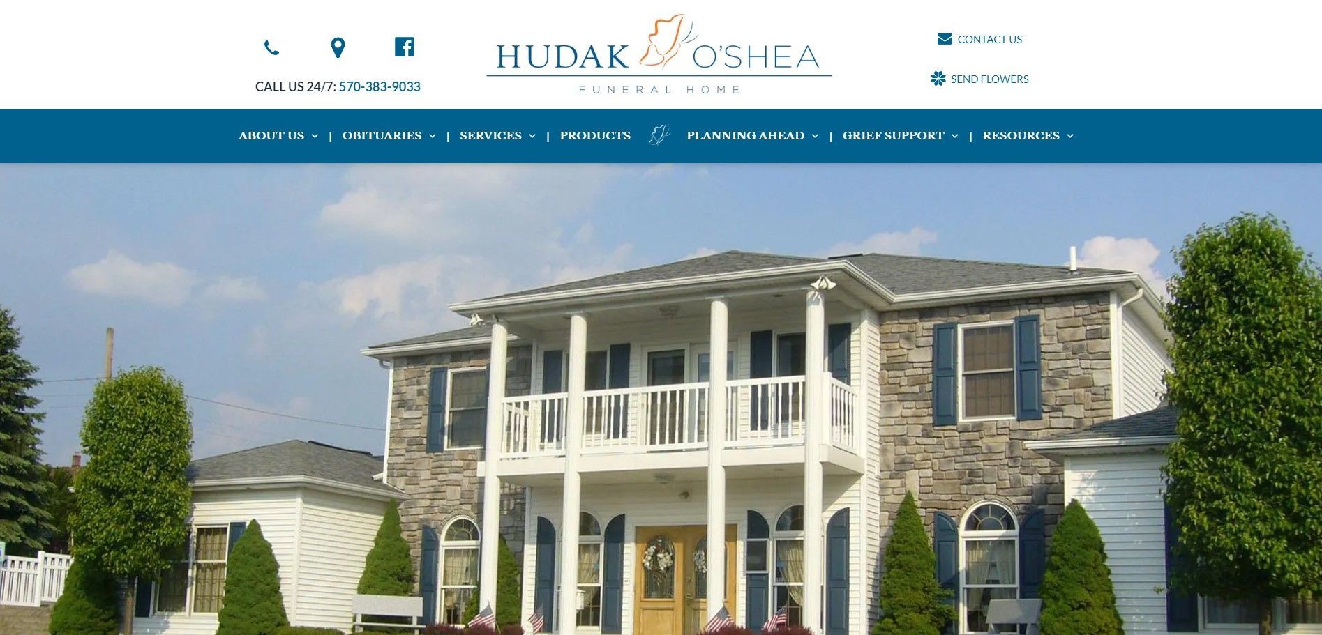 Website header with a two-story building in the background. Blue and white colors are prominent.