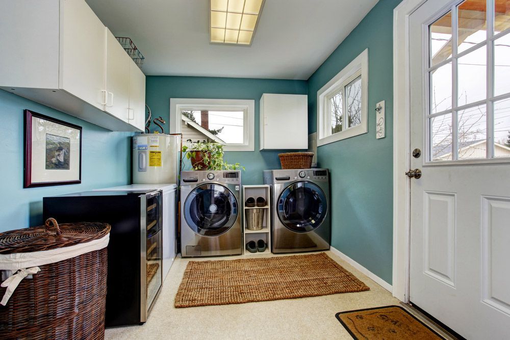 A Laundry Room With Two Washers And Two Dryers — NSL Plumbing and Gas in Banora Point, NSW