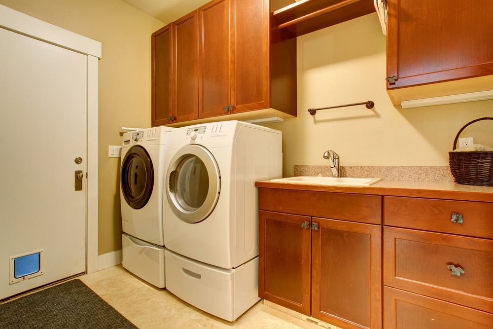 A Laundry Room With A Washer And Dryer And A Sink — NSL Plumbing and Gas in Banora Point, NSW