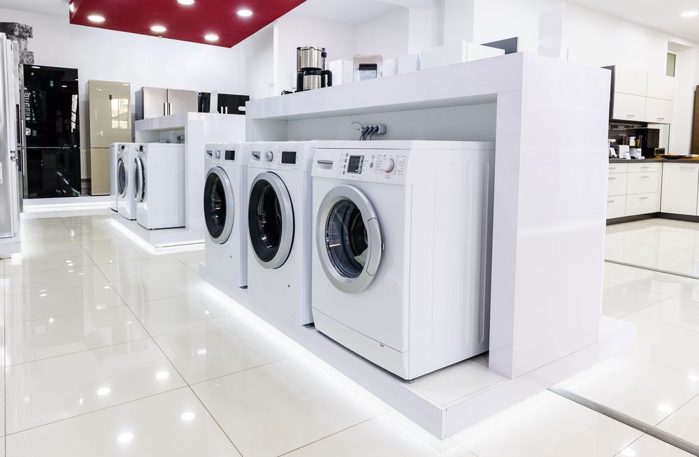A Room Displaying White Front-load Washing Machines — NSL Plumbing and Gas in Banora Point, NSW