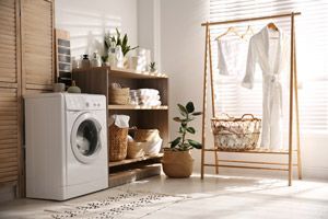 A Laundry Room With A Washing Machine And A Clothes Rack — NSL Plumbing and Gas in Banora Point, NSW