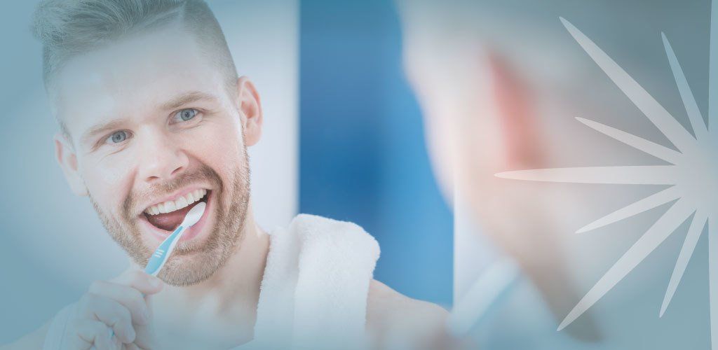 A man brushing his teeth with Teeth Whitening Toothpaste