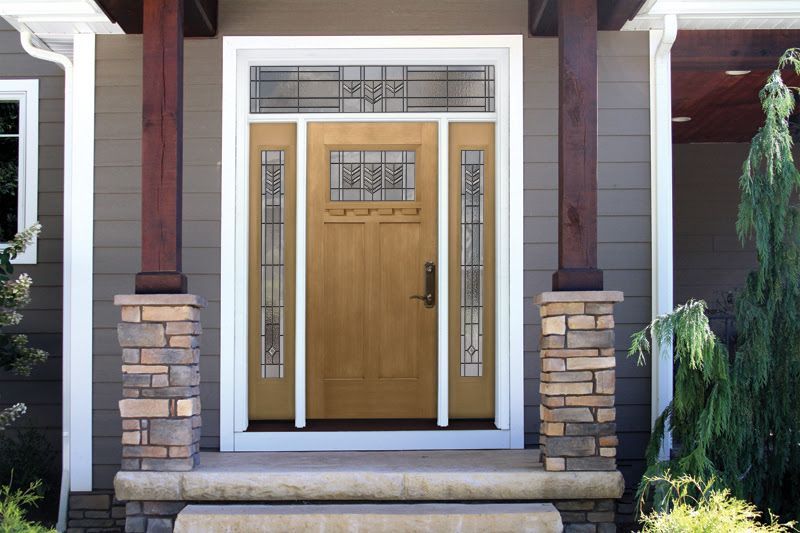 A house with a wooden door and a stone porch