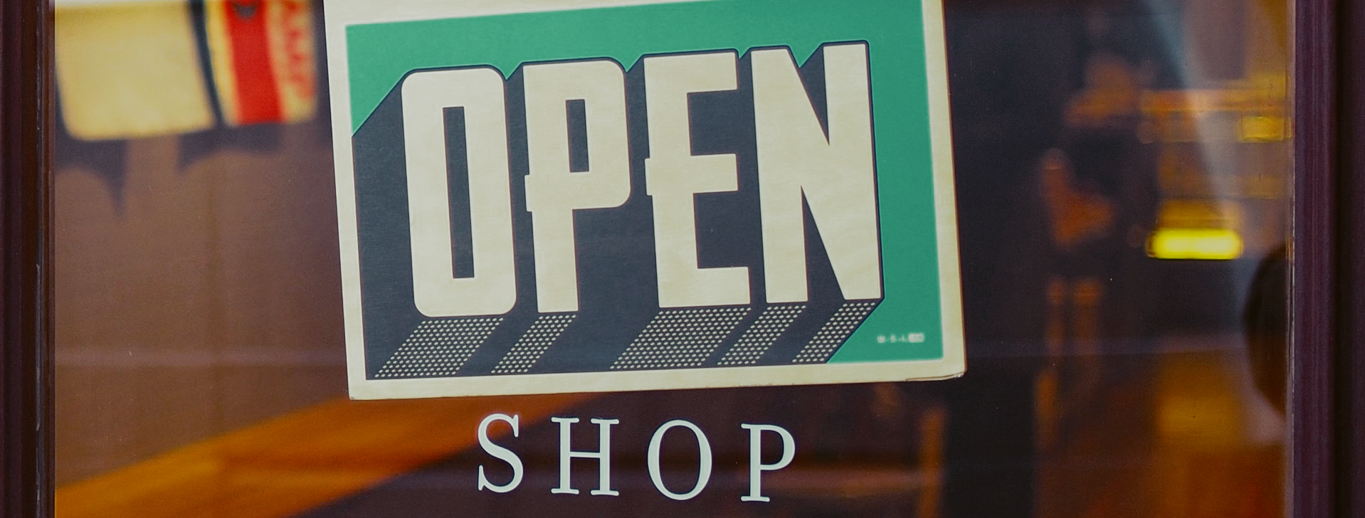 Image of open sign with the word shop below