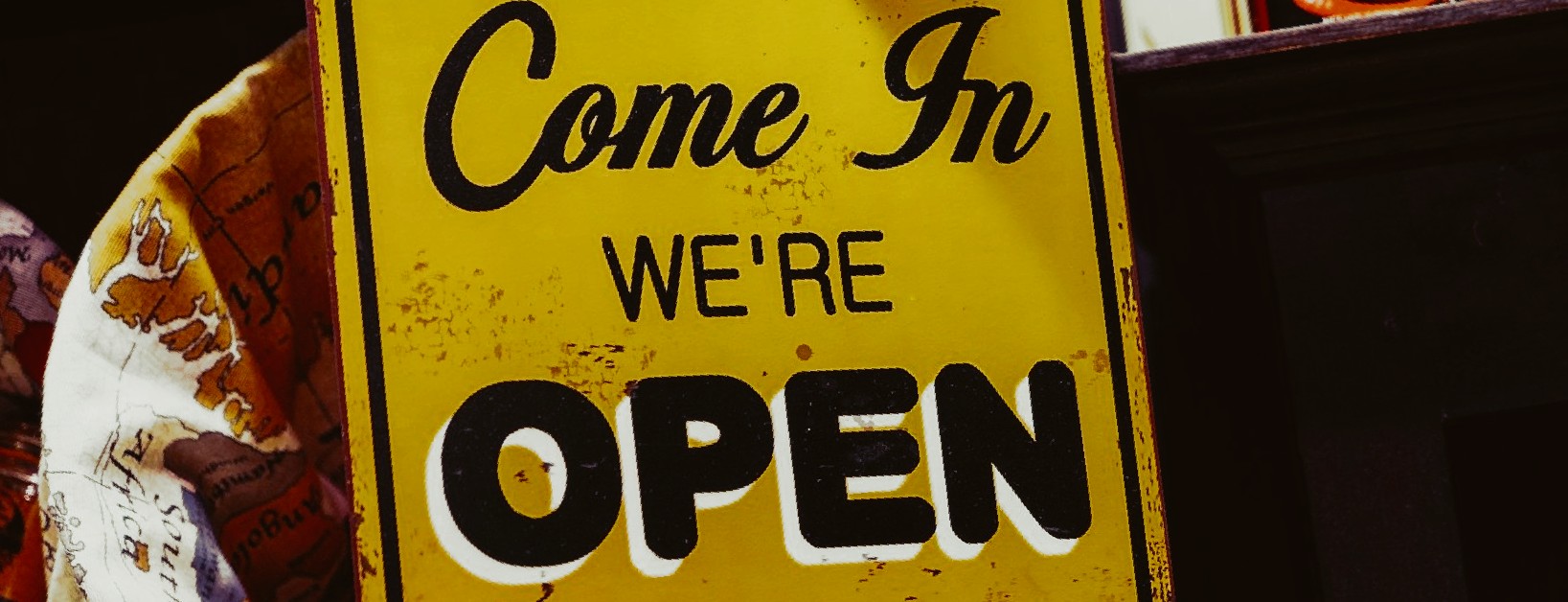 Image of sign stating “Come In We’re open